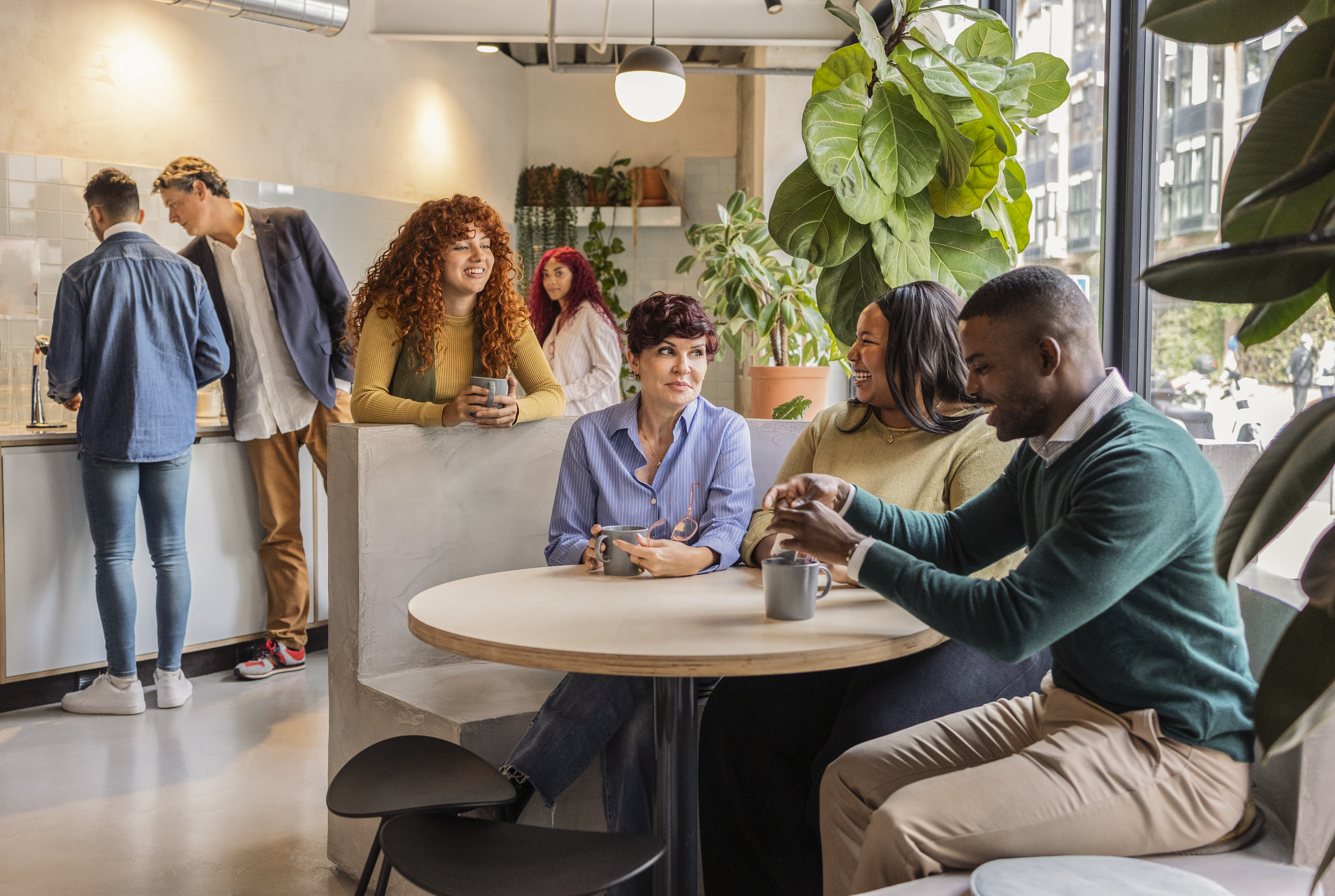 Featured image: An employee sitting at a desk, pausing and writing in a small notebook or journal, possibly with a cup of coffee nearby. - Read full post: Building Self-Awareness at Work: A Simple Guide